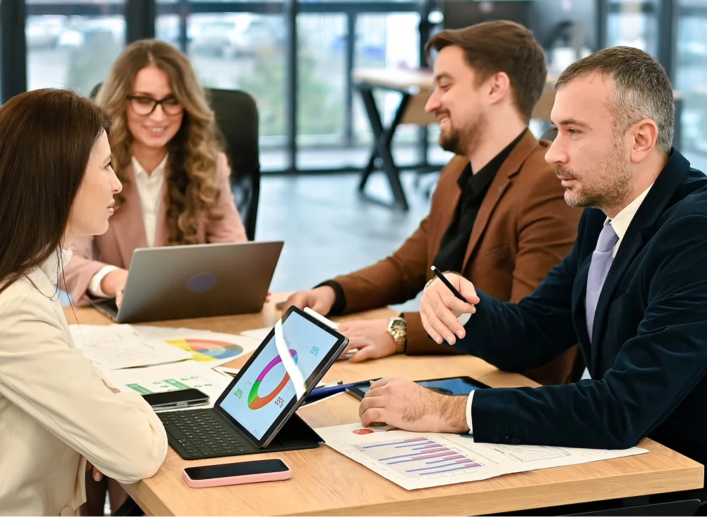 A group of four professionals sitting around a table
